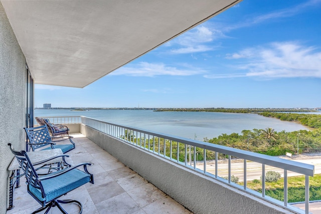 balcony featuring a water view