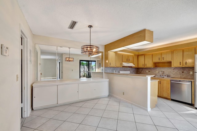 kitchen with under cabinet range hood, dishwasher, tasteful backsplash, and a sink