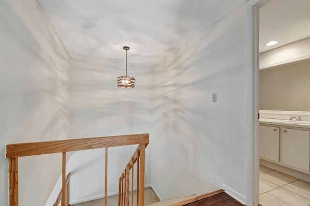 staircase with tile patterned floors