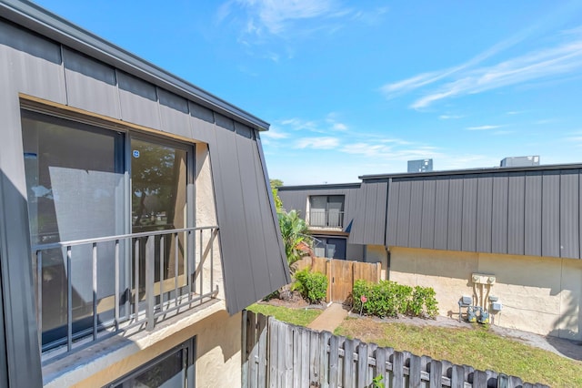 view of home's exterior with a balcony