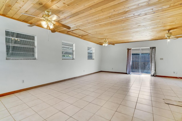 unfurnished room with light tile patterned floors, baseboards, and ceiling fan