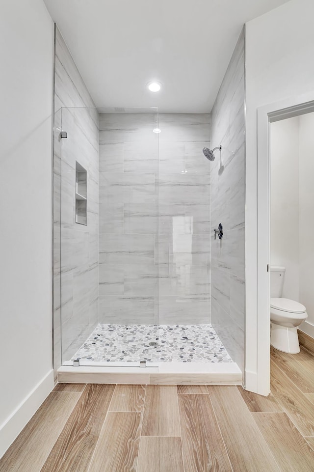 1085 26th St, Vero Beach, FL 32960 - bathroom with a stall shower, recessed lighting, toilet, baseboards, and wood finished floors