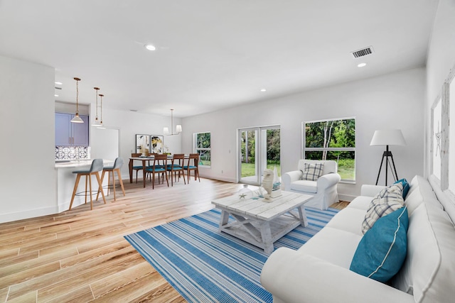 1085 26th St, Vero Beach, FL 32960 - living area with light wood-style flooring, baseboards, visible vents, and recessed lighting