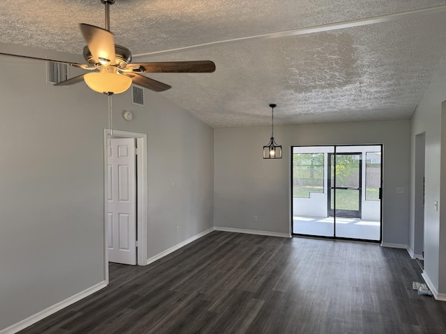 unfurnished room featuring visible vents, a ceiling fan, dark wood finished floors, baseboards, and vaulted ceiling