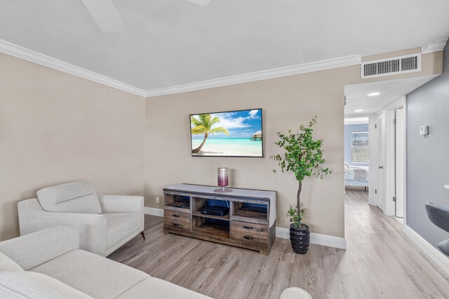 195 Burgundy Unit E, Delray Beach, FL 33484 - living room featuring visible vents, crown molding, baseboards, and wood finished floors