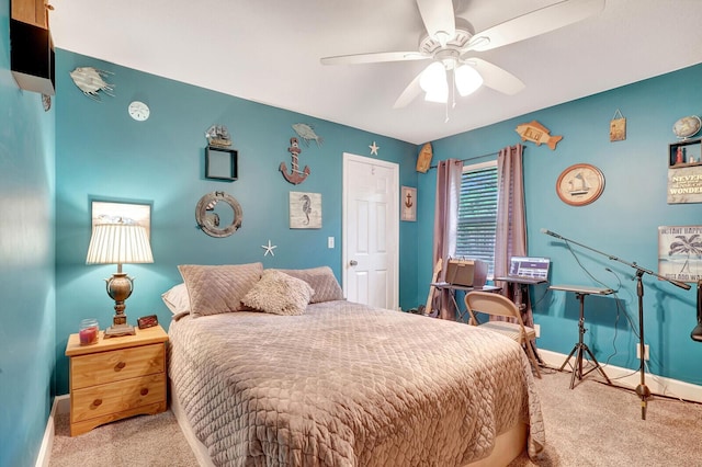 bedroom featuring carpet flooring, a ceiling fan, and baseboards