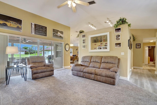 carpeted living room with visible vents, baseboards, and ceiling fan