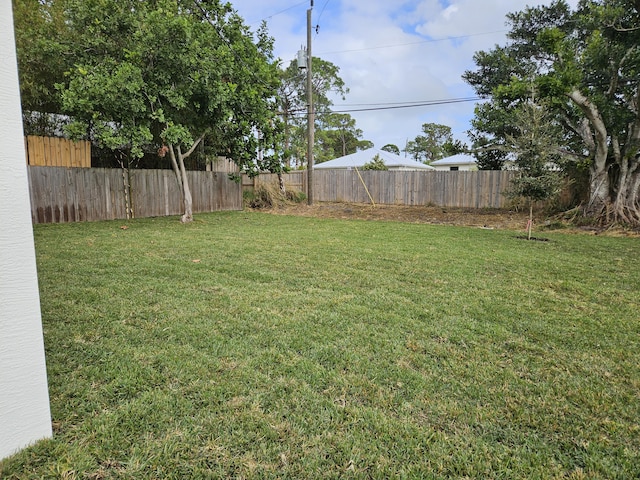 view of yard featuring a fenced backyard