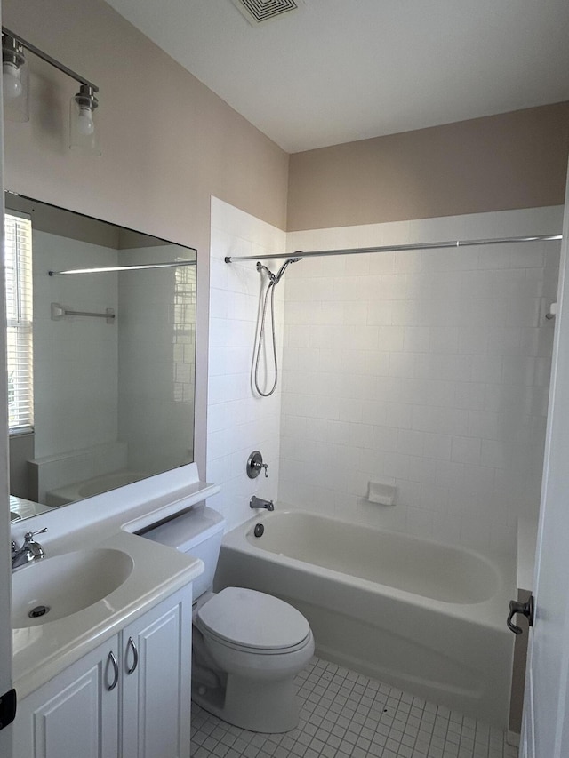 bathroom featuring vanity, tile patterned floors, toilet, and shower / bathing tub combination