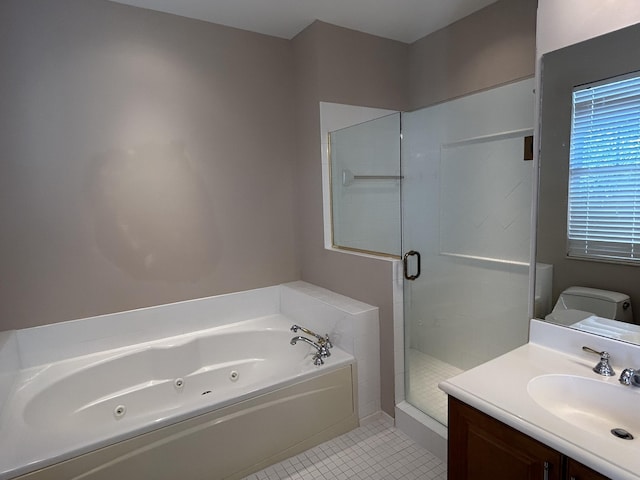 bathroom featuring vanity, a tub with jets, a stall shower, tile patterned floors, and toilet