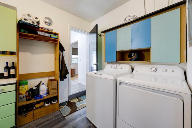 washroom with washer and dryer and dark wood-style flooring