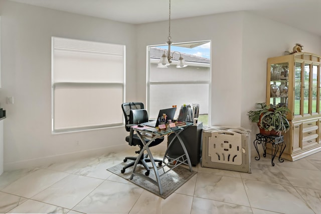 office space featuring marble finish floor and a chandelier