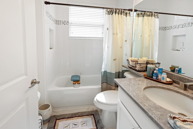 bathroom featuring toilet, vanity, and shower / bath combination with curtain