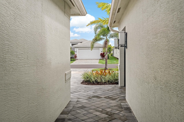 view of patio / terrace featuring a garage