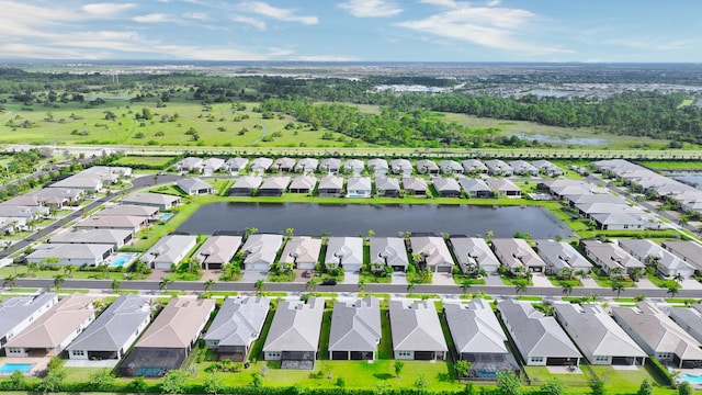 birds eye view of property featuring a residential view and a water view