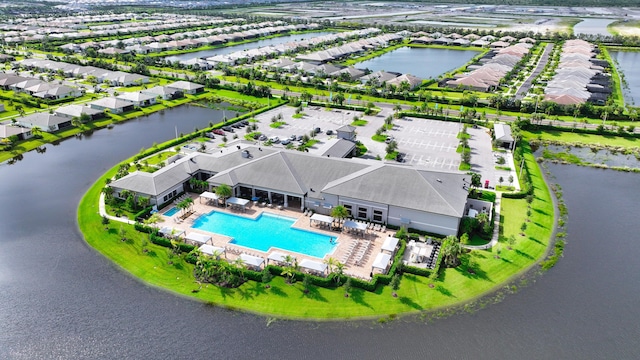 bird's eye view featuring a water view and a residential view