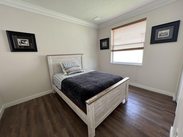 bedroom featuring baseboards, a textured ceiling, ornamental molding, and dark wood-style flooring