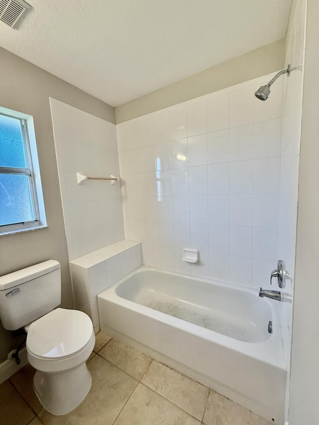 full bathroom with visible vents, toilet, a textured ceiling, tile patterned flooring, and bathtub / shower combination