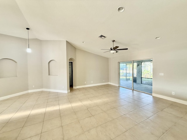 unfurnished room with visible vents, baseboards, ceiling fan, vaulted ceiling, and arched walkways