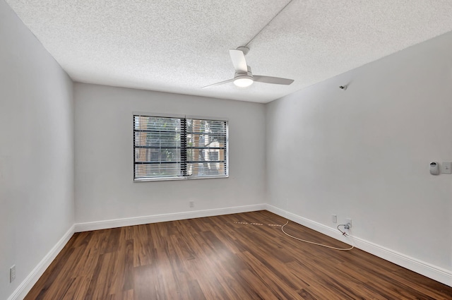 unfurnished room featuring baseboards, a textured ceiling, ceiling fan, and dark wood-style flooring