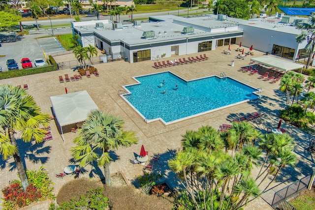 view of swimming pool with a patio area and fence