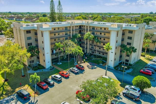 view of property with uncovered parking