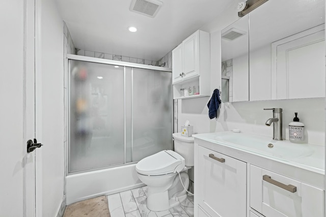 bathroom featuring visible vents, marble finish floor, toilet, and vanity