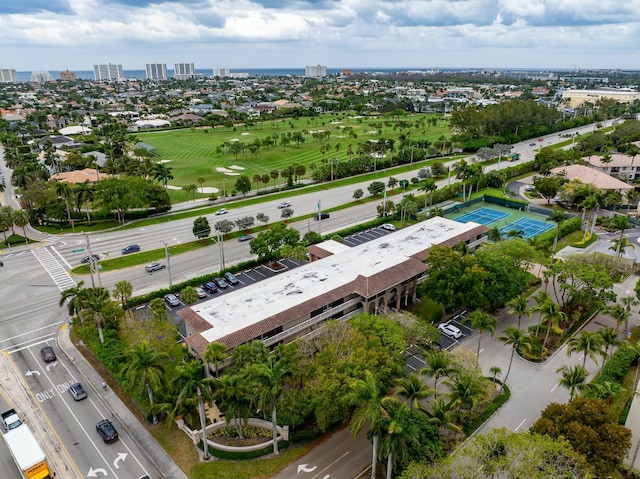 birds eye view of property featuring a city view and view of golf course