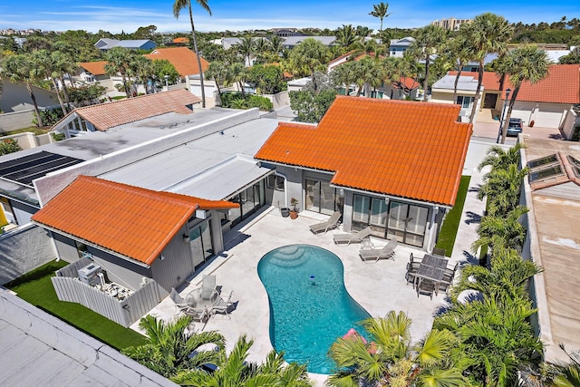 birds eye view of property with a residential view