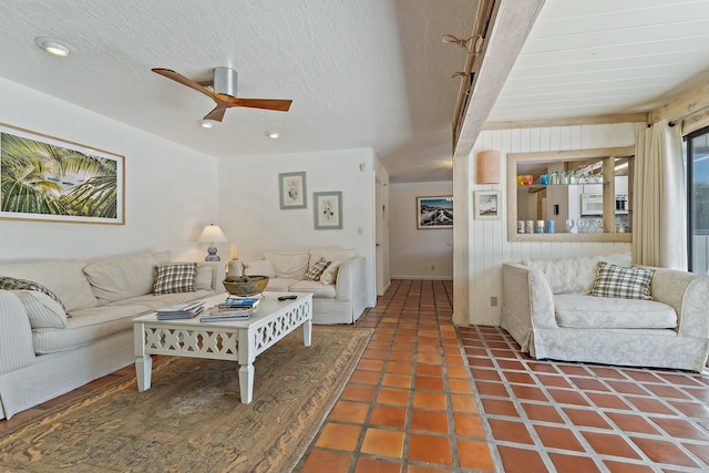 tiled living area with recessed lighting, a textured ceiling, and ceiling fan