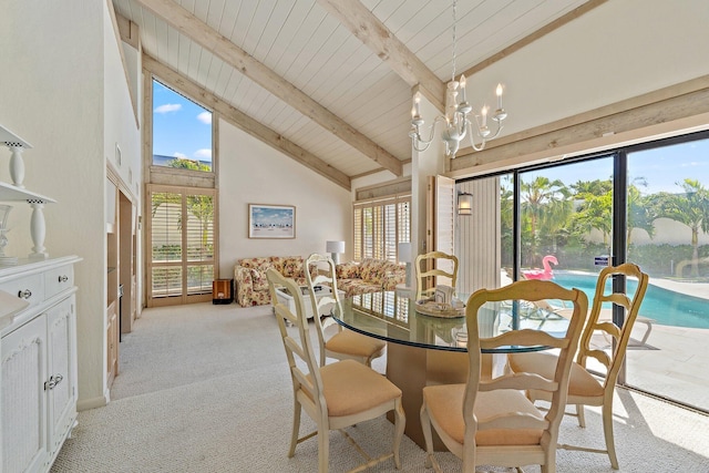 dining area with wood ceiling, beam ceiling, light carpet, a notable chandelier, and high vaulted ceiling