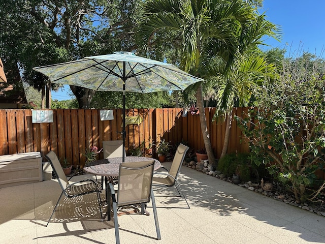 view of patio / terrace with outdoor dining area and fence