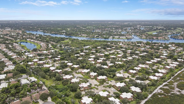 birds eye view of property with a residential view and a water view