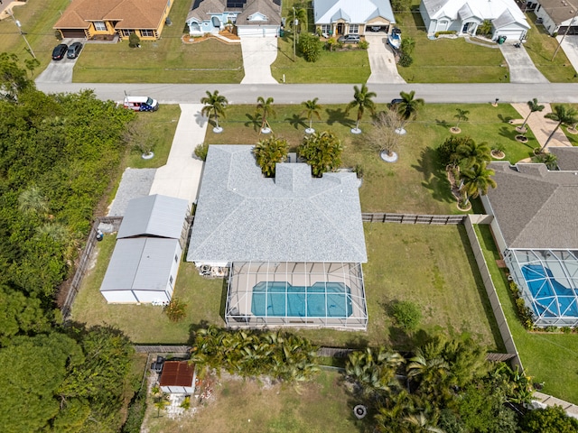 birds eye view of property with a residential view