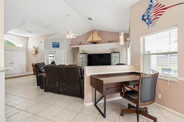 interior space with light tile patterned floors, plenty of natural light, lofted ceiling, and visible vents
