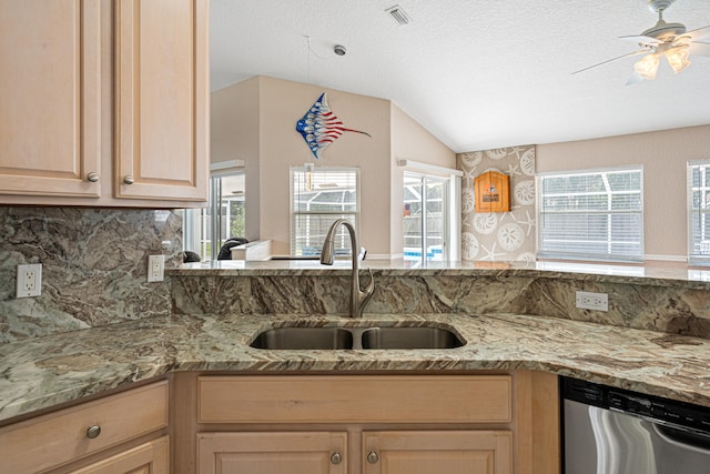 kitchen featuring visible vents, a sink, light stone counters, dishwasher, and ceiling fan