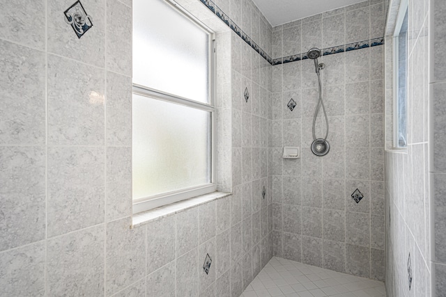 bathroom with tiled shower