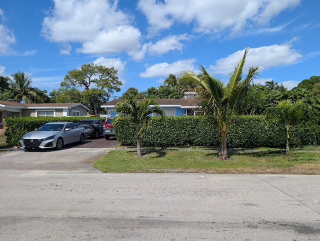 obstructed view of property featuring driveway