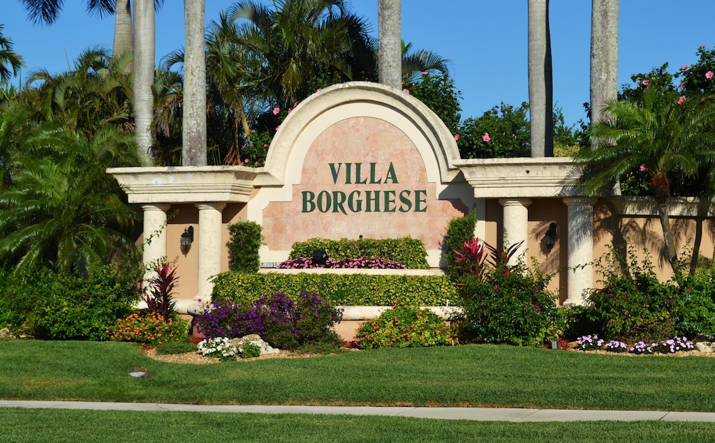 community / neighborhood sign featuring a lawn