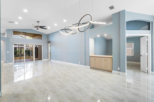 13853 Via Da Vinci, Delray Beach, FL 33446 - unfurnished living room with light marble finish flooring, high vaulted ceiling, ceiling fan, baseboards, and recessed lighting