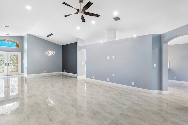 13853 Via Da Vinci, Delray Beach, FL 33446 - spare room featuring arched walkways, a ceiling fan, high vaulted ceiling, light marble finish floors, and baseboards