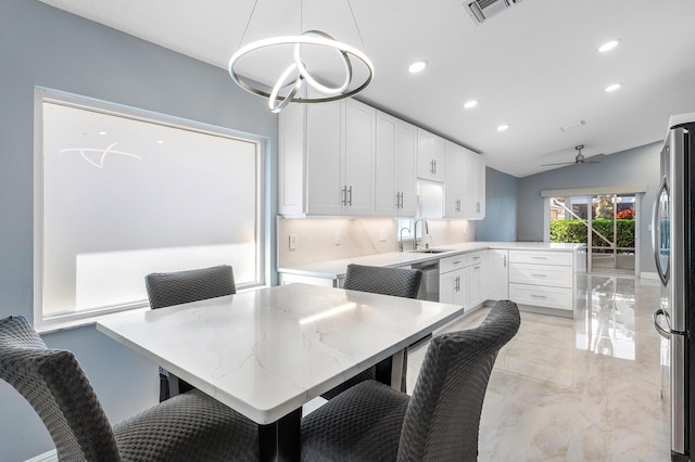 13853 Via Da Vinci, Delray Beach, FL 33446 - dining area with lofted ceiling, light marble finish floors, recessed lighting, and ceiling fan