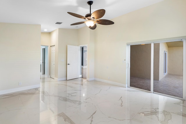 13853 Via Da Vinci, Delray Beach, FL 33446 - unfurnished bedroom with light marble finish floors and a ceiling fan