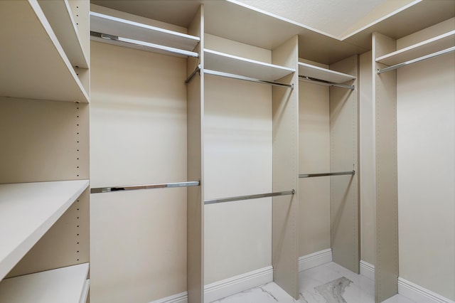 13853 Via Da Vinci, Delray Beach, FL 33446 - walk in closet featuring light marble finish flooring