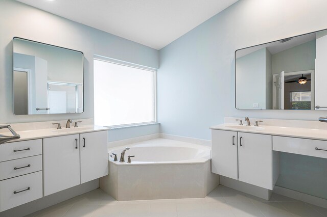 13853 Via Da Vinci, Delray Beach, FL 33446 - bathroom with a bath, two vanities, and tile patterned floors