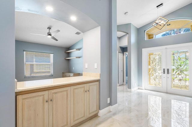 13853 Via Da Vinci, Delray Beach, FL 33446 - kitchen featuring light brown cabinetry, light marble finish floors, arched walkways, a ceiling fan, and light countertops