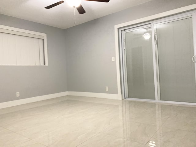 unfurnished bedroom featuring baseboards and ceiling fan