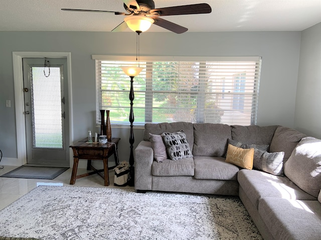 living area with a ceiling fan