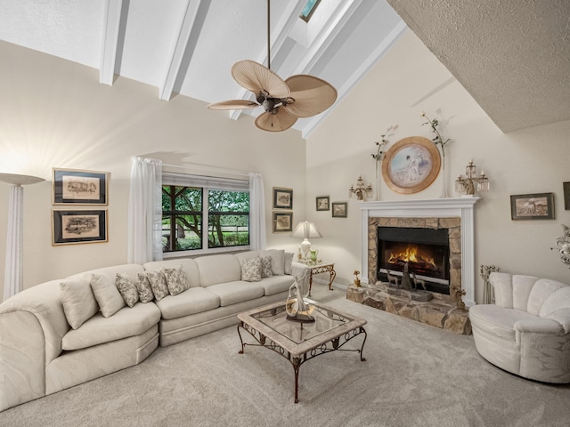 living room with a ceiling fan, carpet floors, high vaulted ceiling, a fireplace, and beamed ceiling