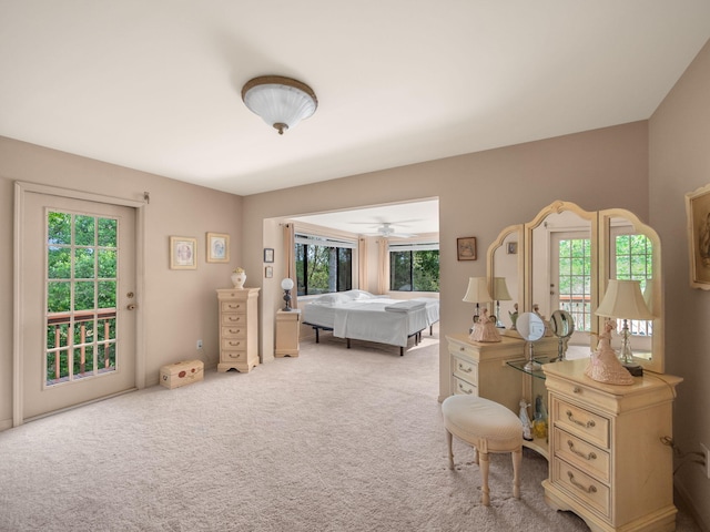 bedroom featuring access to exterior and carpet